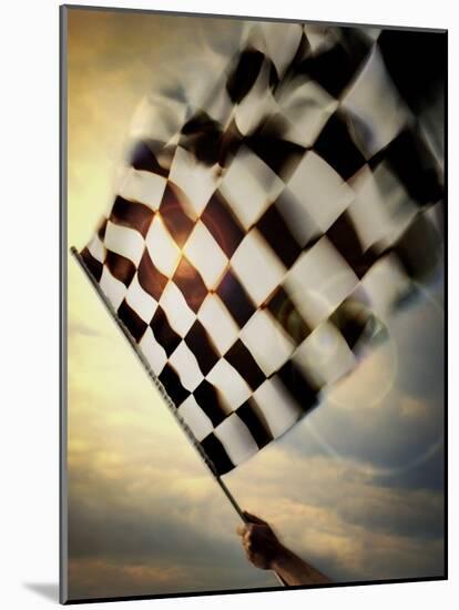 Person's Hand Waving a Checkered Flag-null-Mounted Photographic Print