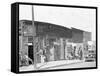 person shop fronts in Vicksburg, Mississippi, 1936-Walker Evans-Framed Stretched Canvas