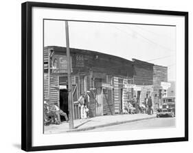 person shop fronts in Vicksburg, Mississippi, 1936-Walker Evans-Framed Photographic Print