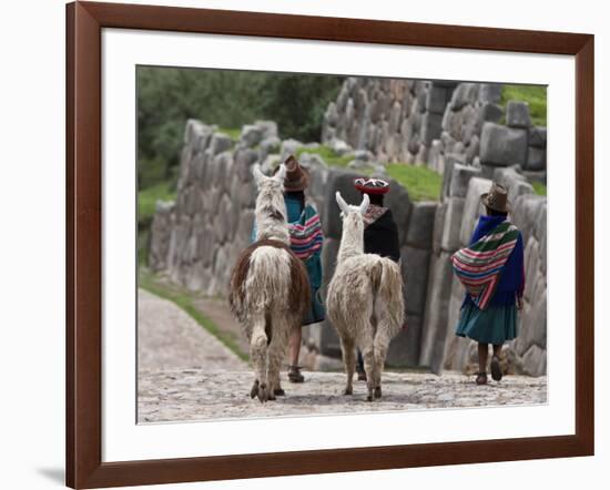 Peru, Native Indian Women Lead their Llamas Past the Ruins of Saqsaywaman-Nigel Pavitt-Framed Photographic Print