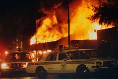 Burning Buildings with Police on the Scene-Pete Cosgrove-Photographic Print