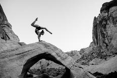 Female gymnast in desert, Overton, Nevada, USA-Pete Saloutos-Photographic Print