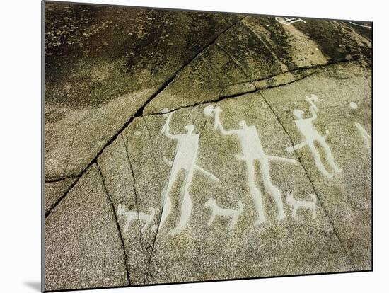 Petroglyph with three men brandishing axes, accompanied by dogs-Werner Forman-Mounted Giclee Print