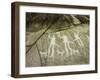 Petroglyph with three men brandishing axes, accompanied by dogs-Werner Forman-Framed Giclee Print