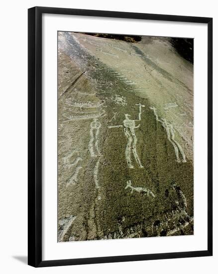 Petroglyph with two men facing each other and brandishing axes, Bronze Age-Werner Forman-Framed Giclee Print