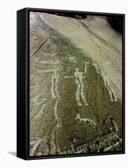 Petroglyph with two men facing each other and brandishing axes, Bronze Age-Werner Forman-Framed Stretched Canvas