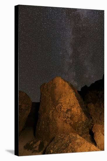 Petroglyphs and Milky Way at night, Great Basin near Mono Lake, California.-Adam Jones-Stretched Canvas