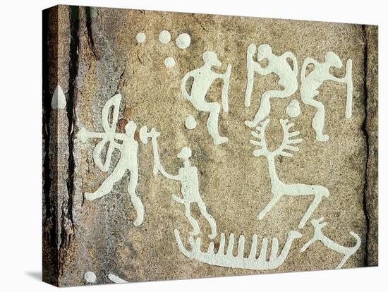 Petroglyphs; figures brandishing weapons, with a reindeer-Werner Forman-Stretched Canvas