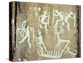 Petroglyphs; figures brandishing weapons, with a reindeer-Werner Forman-Stretched Canvas