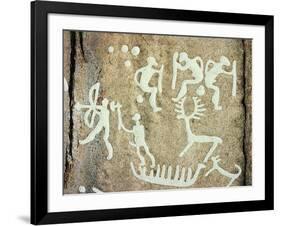 Petroglyphs; figures brandishing weapons, with a reindeer-Werner Forman-Framed Giclee Print