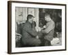 'Petty Officer Evans Binding Up Dr. Atkinson's Hand', 5 July 1911, (1913)-Herbert Ponting-Framed Photographic Print