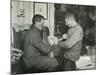 'Petty Officer Evans Binding Up Dr. Atkinson's Hand', 5 July 1911, (1913)-Herbert Ponting-Mounted Photographic Print