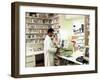 Pharmacist Using a Computer In a Pharmacy-Geoff Tompkinson-Framed Photographic Print