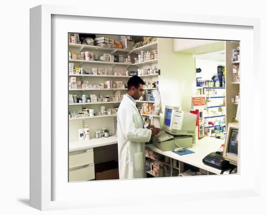 Pharmacist Using a Computer In a Pharmacy-Geoff Tompkinson-Framed Photographic Print