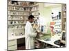 Pharmacist Using a Computer In a Pharmacy-Geoff Tompkinson-Mounted Photographic Print