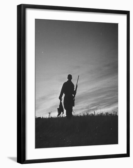 Pheasant Hunter Carrying Bird That He Killed-Wallace Kirkland-Framed Photographic Print