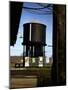 Photo Taken from Window of a Train Showing Water Storage Tower Beside Tracks-Walker Evans-Mounted Photographic Print