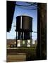 Photo Taken from Window of a Train Showing Water Storage Tower Beside Tracks-Walker Evans-Mounted Photographic Print