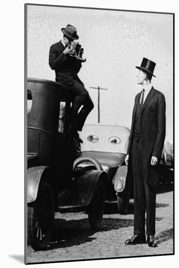 Photographer Mounts Himself on Roof of a Car to Shoot a Pictures of Exceedingly Tall Men in Top Hat-null-Mounted Art Print