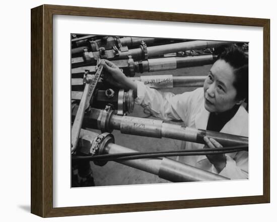 Physicist Dr. Chien-Shiung Wu Standing Amidst Tubes of Particle Accelerator at Columbia University-null-Framed Photographic Print