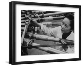 Physicist Dr. Chien-Shiung Wu Standing Amidst Tubes of Particle Accelerator at Columbia University-null-Framed Photographic Print