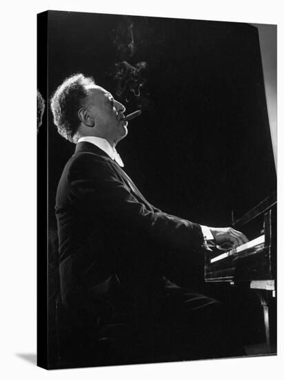 Pianist Arthur Rubenstein at the Piano, Smoking Cigar-Gjon Mili-Stretched Canvas