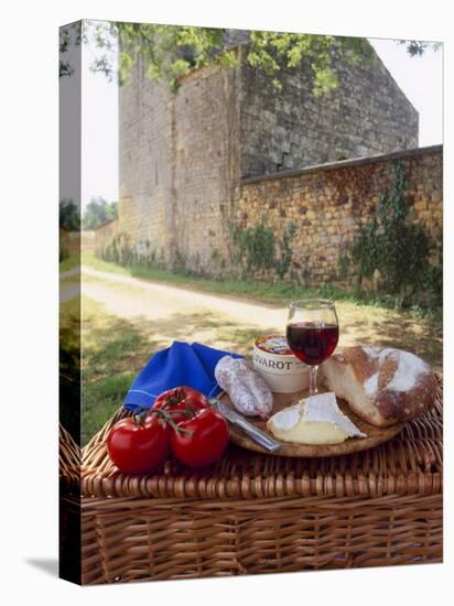 Picnic Lunch of Bread, Cheese, Tomatoes and Red Wine on a Hamper in the Dordogne, France-Michael Busselle-Stretched Canvas
