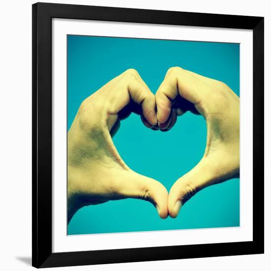 Picture Of Man Hands Forming A Heart Over The Blue Sky, With A Retro Effect-nito-Framed Art Print