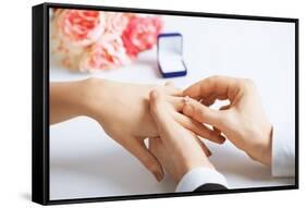 Picture of Man Putting Wedding Ring on Woman Hand-dolgachov-Framed Stretched Canvas