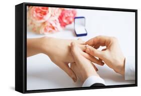 Picture of Man Putting Wedding Ring on Woman Hand-dolgachov-Framed Stretched Canvas