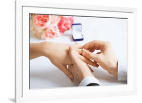 Picture of Man Putting Wedding Ring on Woman Hand-dolgachov-Framed Photographic Print