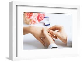 Picture of Man Putting Wedding Ring on Woman Hand-dolgachov-Framed Photographic Print