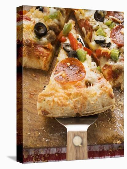 Piece of Pepperoni Pizza with Peppers and Olives on Server-null-Stretched Canvas