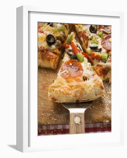 Piece of Pepperoni Pizza with Peppers and Olives on Server-null-Framed Photographic Print