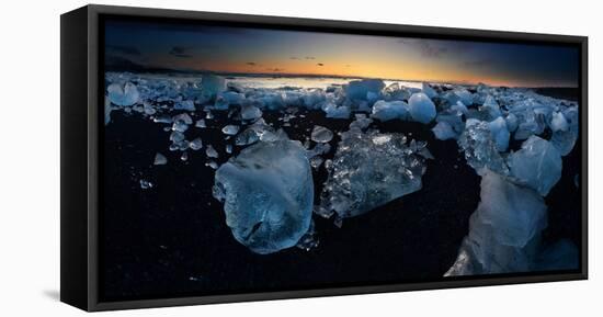 Pieces of glacial ice over black sand being washed by waves, Iceland-Raul Touzon-Framed Stretched Canvas