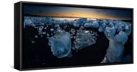 Pieces of glacial ice over black sand being washed by waves, Iceland-Raul Touzon-Framed Stretched Canvas