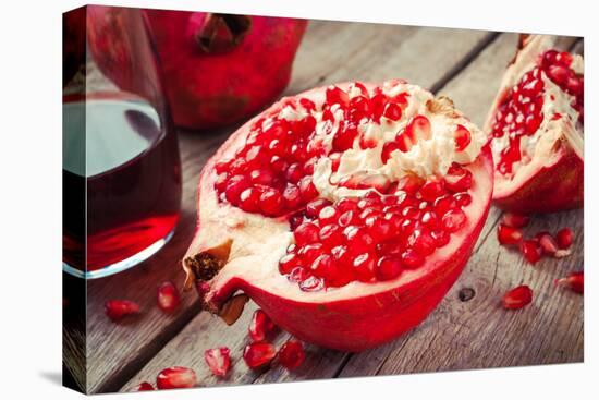 Pieces of Ripe Pomegranate and Juice in Glass-ChamilleWhite-Stretched Canvas