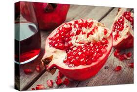 Pieces of Ripe Pomegranate and Juice in Glass-ChamilleWhite-Stretched Canvas