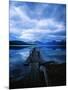 Pier at Lake McDonald Under Clouds-Aaron Horowitz-Mounted Photographic Print