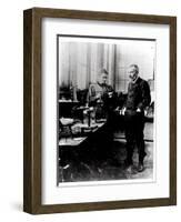 Pierre (1859-1906) and Marie Curie (1867-1934) in their Laboratory, c.1900-Valerian Gribayedoff-Framed Giclee Print