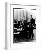 Pierre (1859-1906) and Marie Curie (1867-1934) in their Laboratory, c.1900-Valerian Gribayedoff-Framed Giclee Print