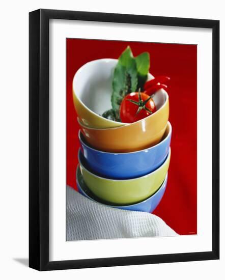 Pile of Soup Bowls with Tomato, Bay Leaf and Chilis-Karl Newedel-Framed Photographic Print