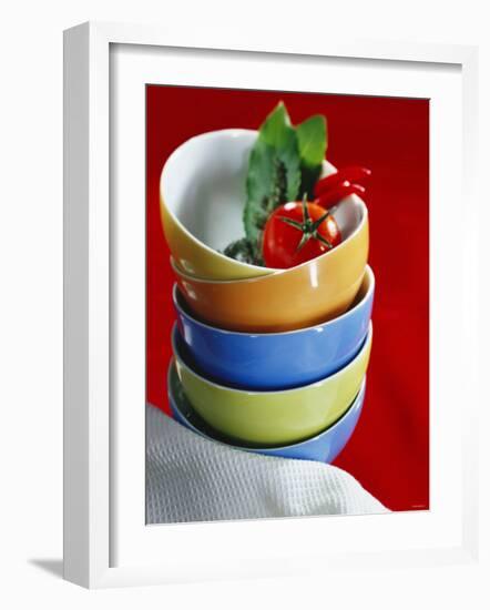 Pile of Soup Bowls with Tomato, Bay Leaf and Chilis-Karl Newedel-Framed Photographic Print