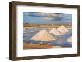 Piles of salts among salt flats with windmills in the background at sunset-Paolo Graziosi-Framed Photographic Print