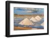 Piles of salts among salt flats with windmills in the background at sunset-Paolo Graziosi-Framed Photographic Print