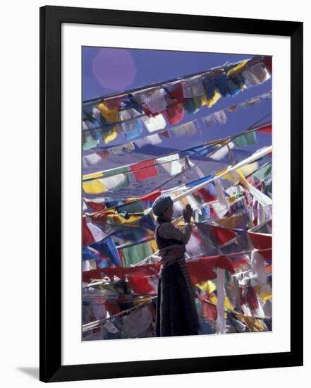 Pilgrim Praying Among Flags, Tibet-Keren Su-Framed Photographic Print