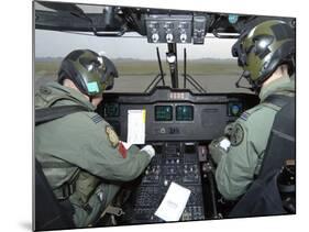 Pilots Inside the Cockpit of a Royal Air Force Merlin Helicopter at RAF Lyneham-Stocktrek Images-Mounted Photographic Print