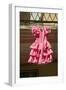 Pink flamenco dress for little girl hangs in Centro old district of Sevilla Spain-null-Framed Photographic Print