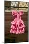 Pink flamenco dress for little girl hangs in Centro old district of Sevilla Spain-null-Mounted Photographic Print