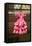 Pink flamenco dress for little girl hangs in Centro old district of Sevilla Spain-null-Framed Stretched Canvas